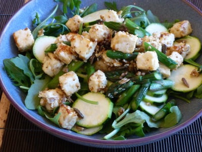 Asparagus and paneer on a bed of rocket and courgettes